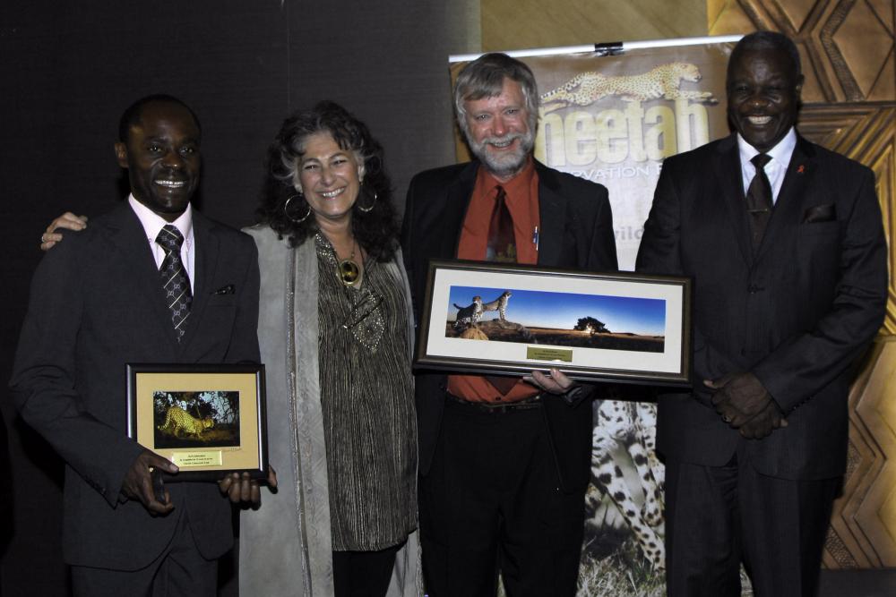 Two senior staff members of the Cheetah Conservation Fund were celebrated for their 15 years of service: Matti Nghikembua, Senior Ecologist (left), and Dr. Bruce Brewer, General Manager of CCF and CCF Bush Pty Ltd (third from left). (c) Cheetah Conservation Fund - Rob Thomson